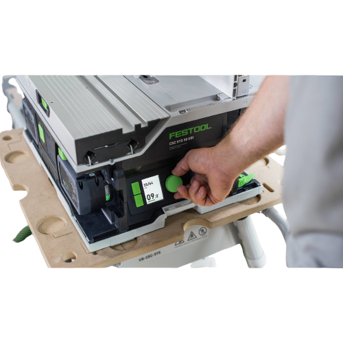 User adjusting the green control knob on a compact Festool cordless table saw set placed on a portable work stand, part of Power Tools and Electric Power Tools collections.