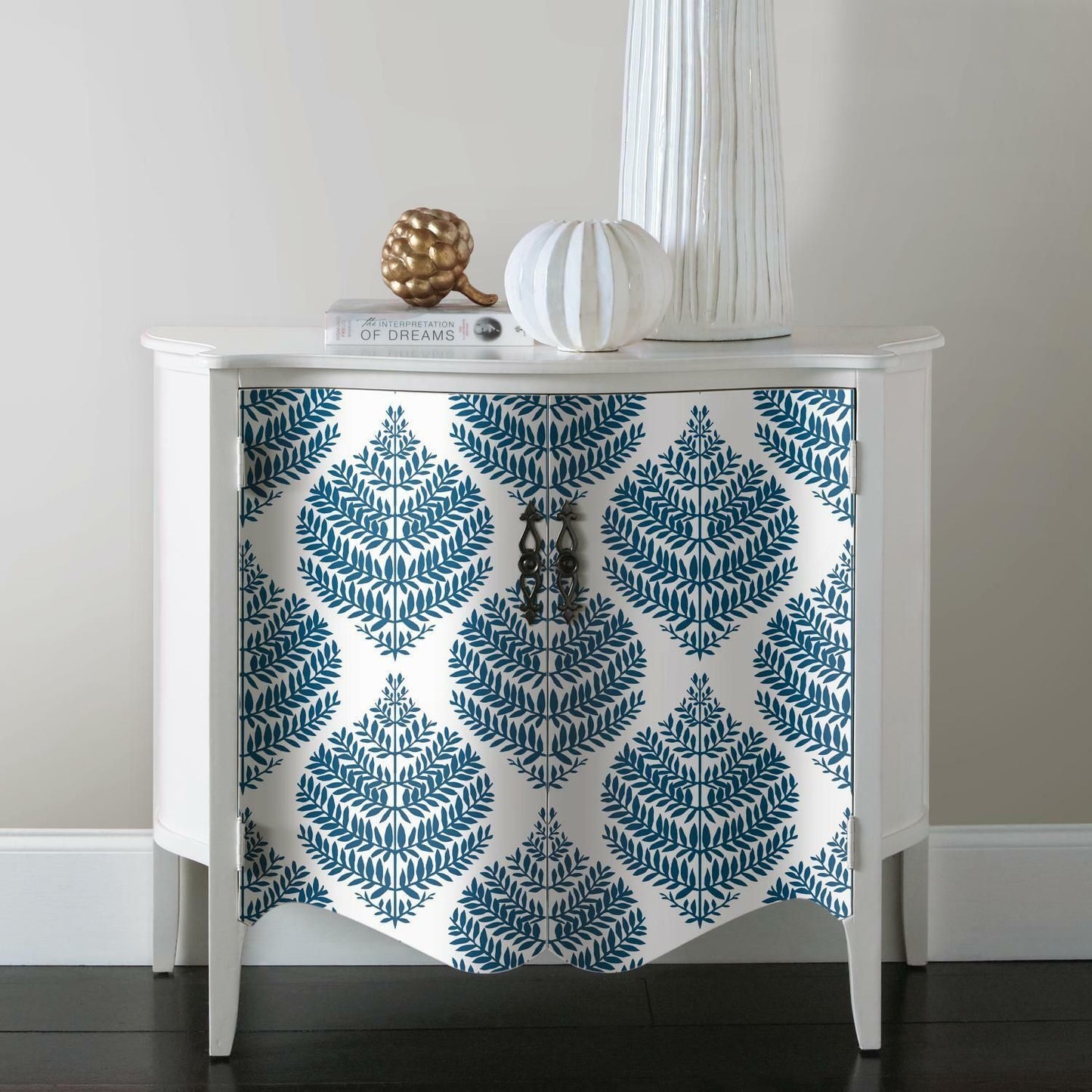 White cabinet front covered with blue fern damask peel and stick wallpaper in modern home decor setting