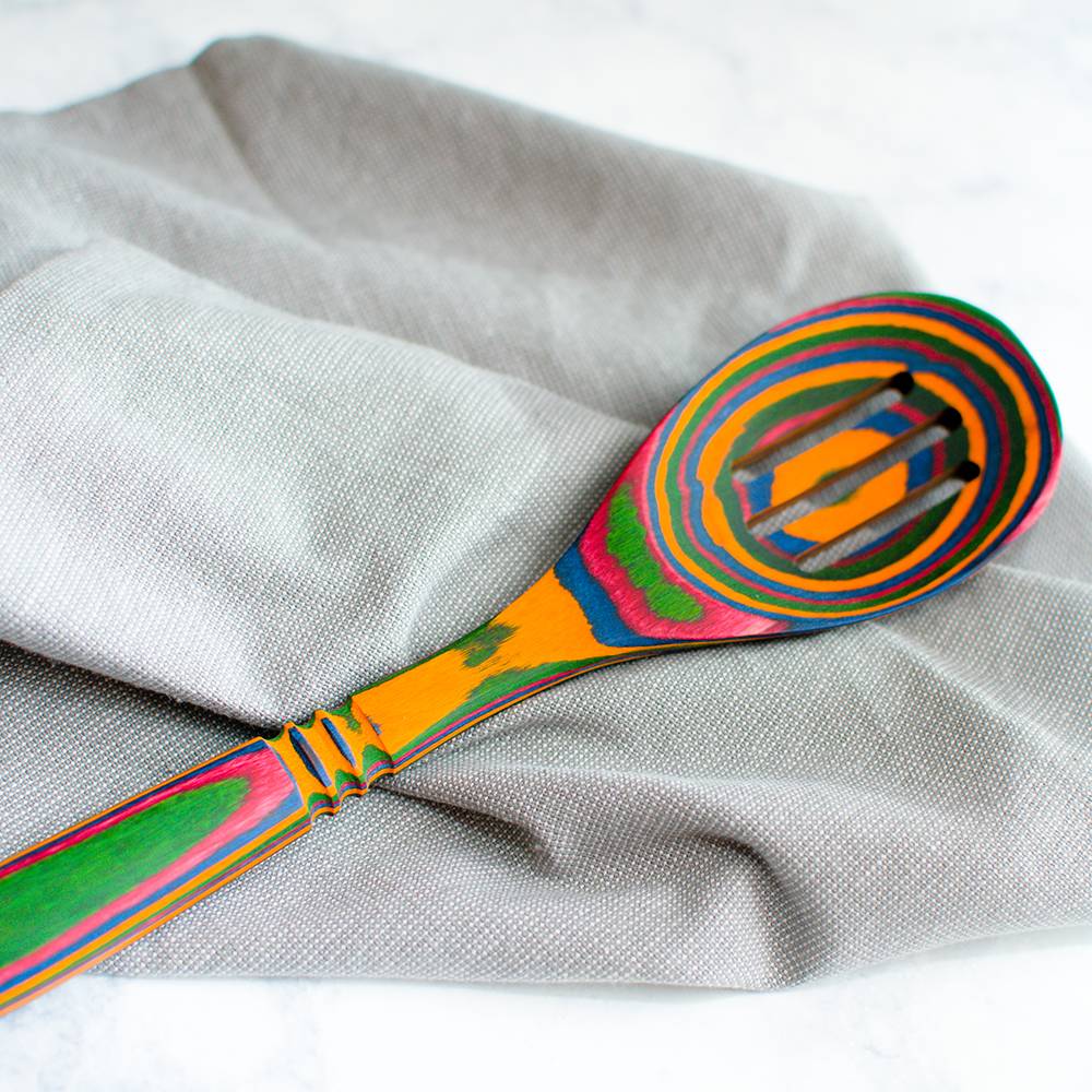 Colorful pakkawood slotted spoon with striped vibrant layers for kitchen utensils and cooking tools under $50 kitchenware collection