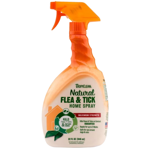 Orange spray bottle of TropiClean Natural flea and tick home spray with detailed product label visible