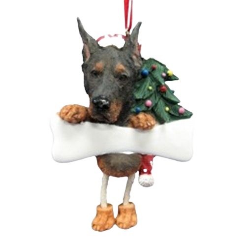 Black and tan Doberman ornament with dangling legs holding a large white bone and decorated with a Christmas tree on its back