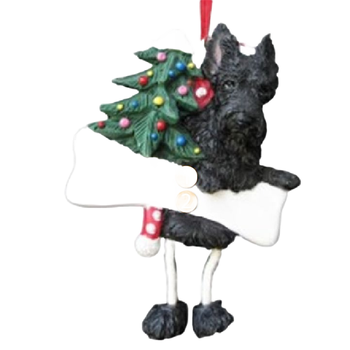 Black Scottie dog ornament holding a decorated Christmas tree with dangling legs for holiday decoration
