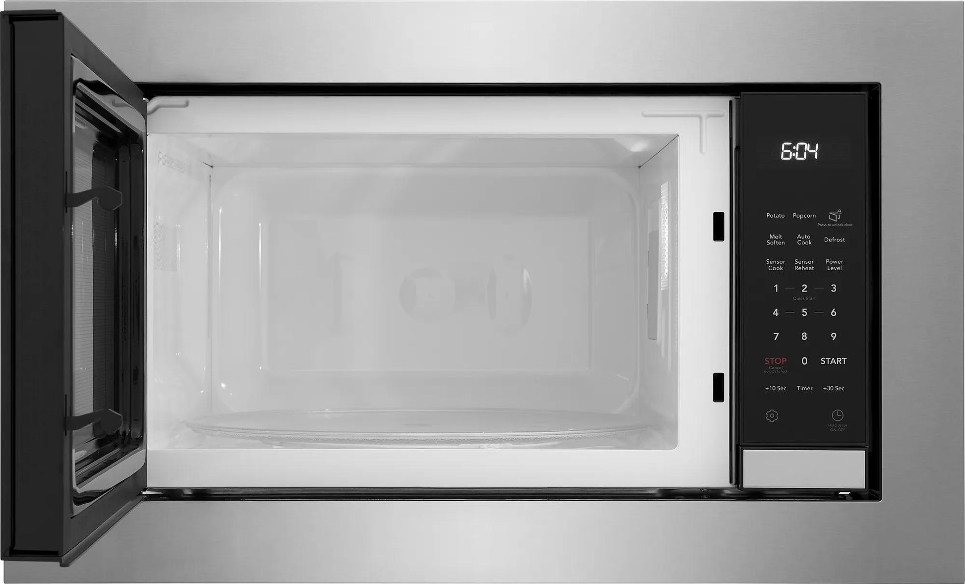 Open built-in microwave with digital control panel and LED clock for kitchen appliances and home improvement