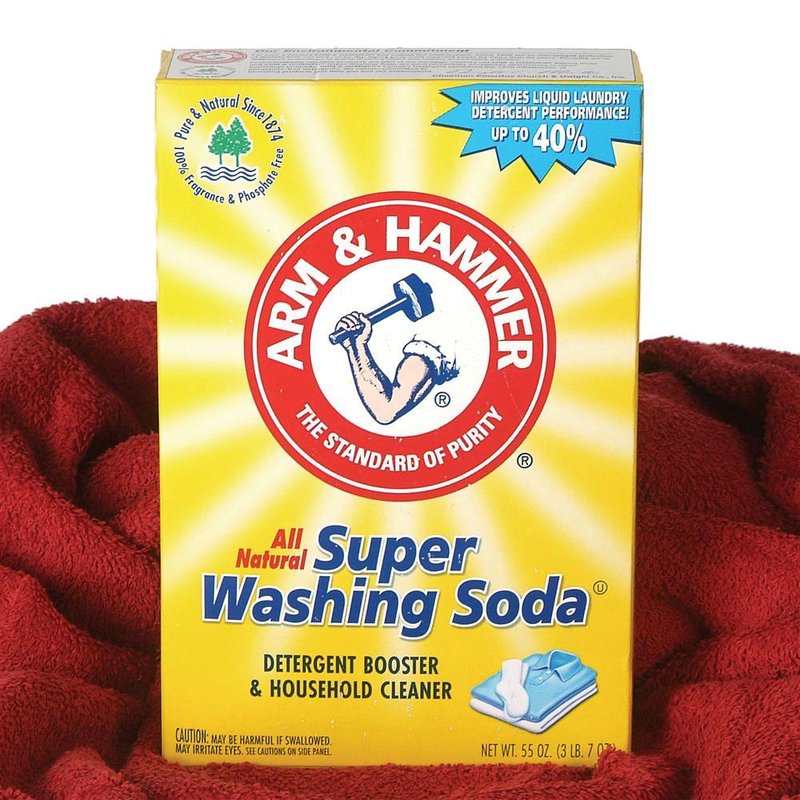Yellow box of Arm & Hammer natural super washing soda for boosting laundry detergent and household cleaning tasks