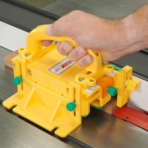 Yellow precision push block with adjustable green knobs for enhanced safety in power tool and saw accessory collections