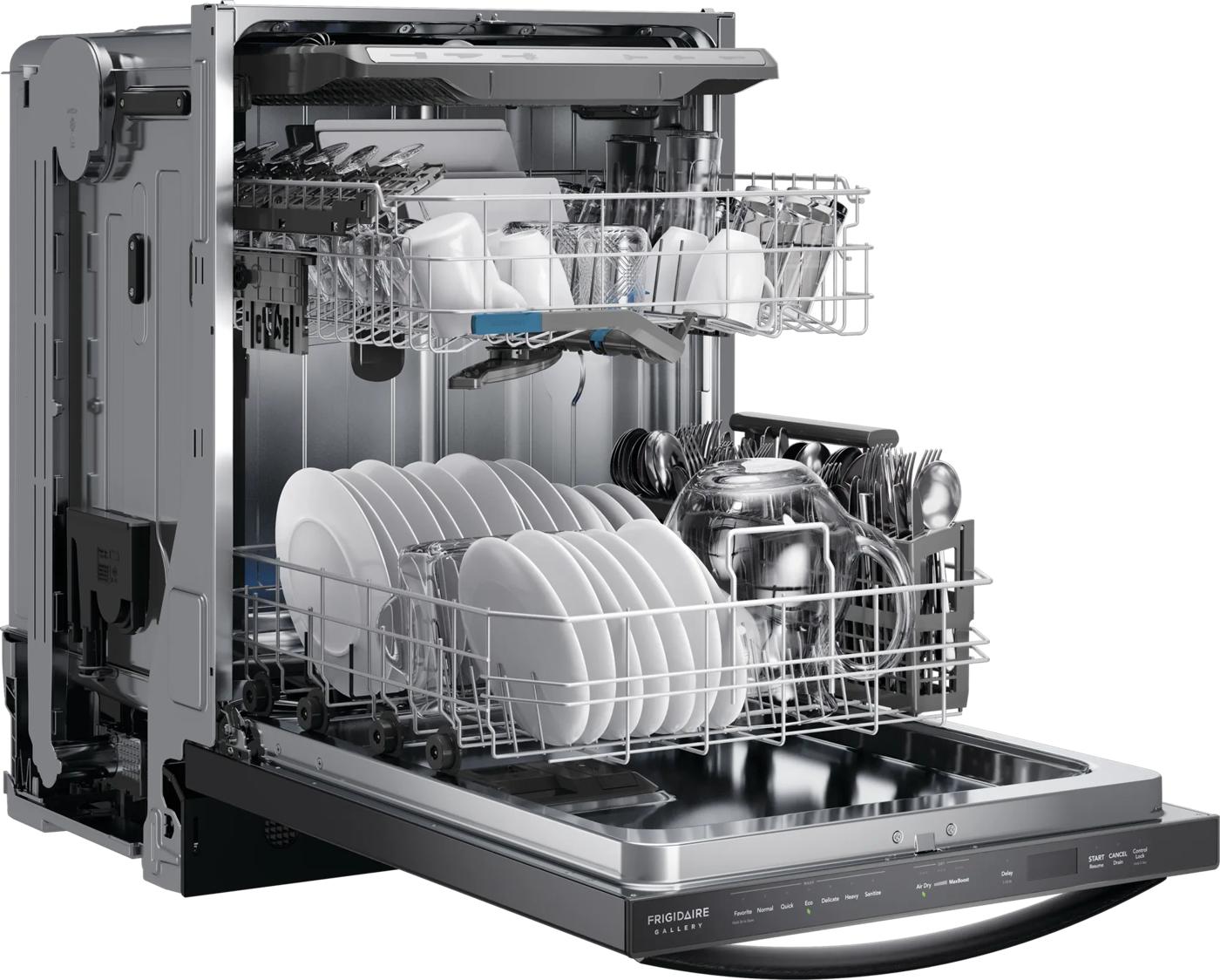 Open built-in dishwasher with stainless steel tub loaded with dishes and utensils in kitchen appliance collection