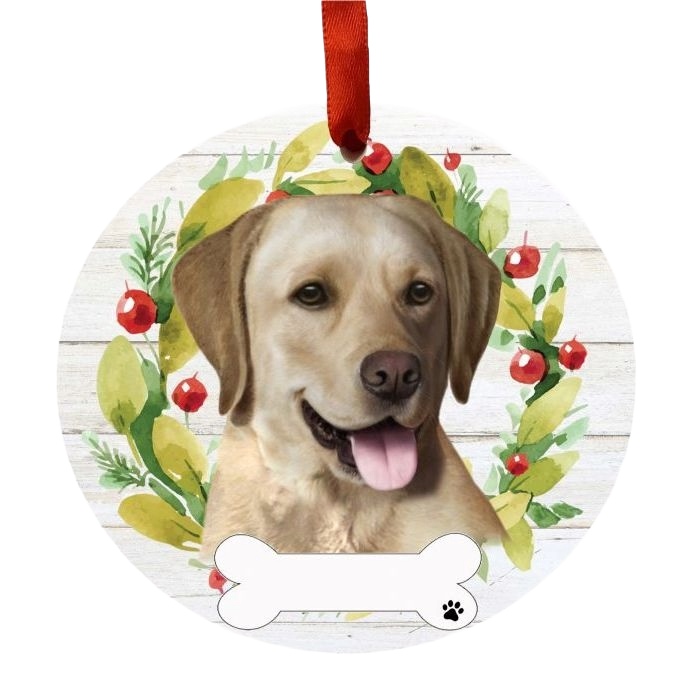 Round Christmas ornament with a Yellow Labrador face inside a green and red festive wreath with a hanging ribbon