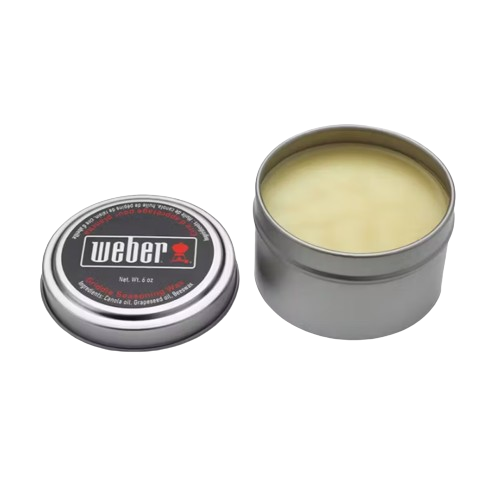 Open metal tin of griddle seasoning wax for maintaining nonstick grilling surfaces in outdoor cooking accessories