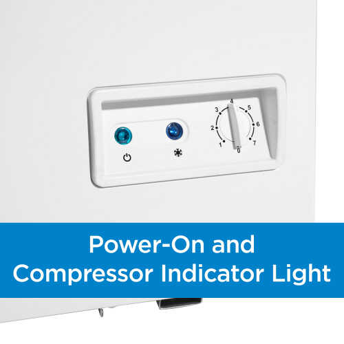 Close-up of chest freezer control panel with temperature dial and power and compressor indicator lights in appliances collection