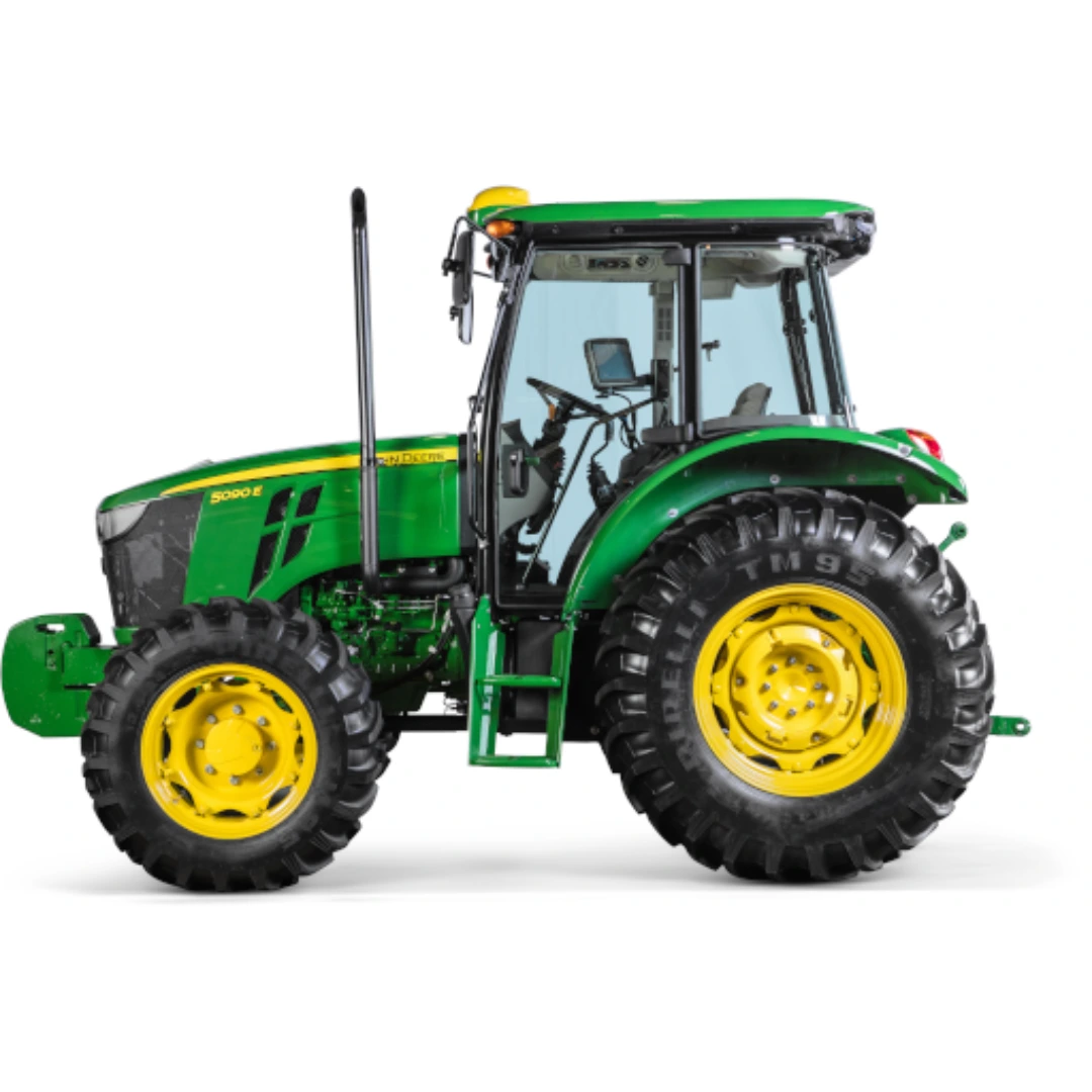 Green and yellow utility tractor with enclosed cab and rugged tires designed for heavy-duty farm and home improvement tasks