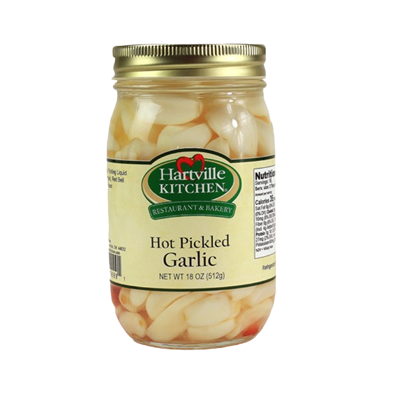 Glass jar of spicy pickled garlic cloves with gold lid, part of Hartville Kitchen preserved goods collection under $50