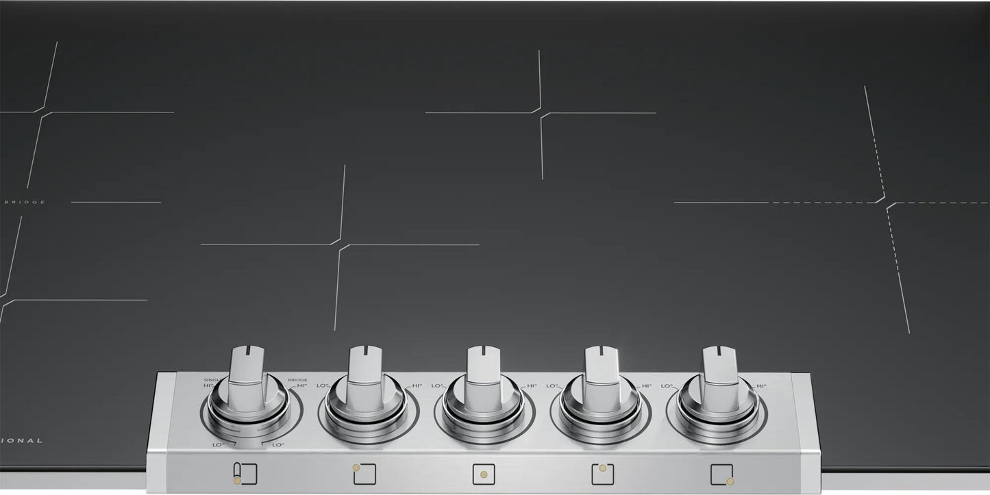 Induction cooktop with five silver control knobs on a smooth black surface in kitchenware and appliances collection