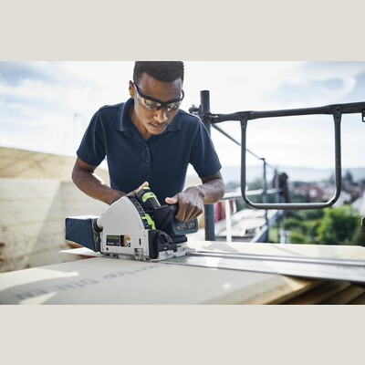 Worker using Festool 577677 TSC 55 KEBI-F-Plus cordless track saw on battery powered saw for home improvement