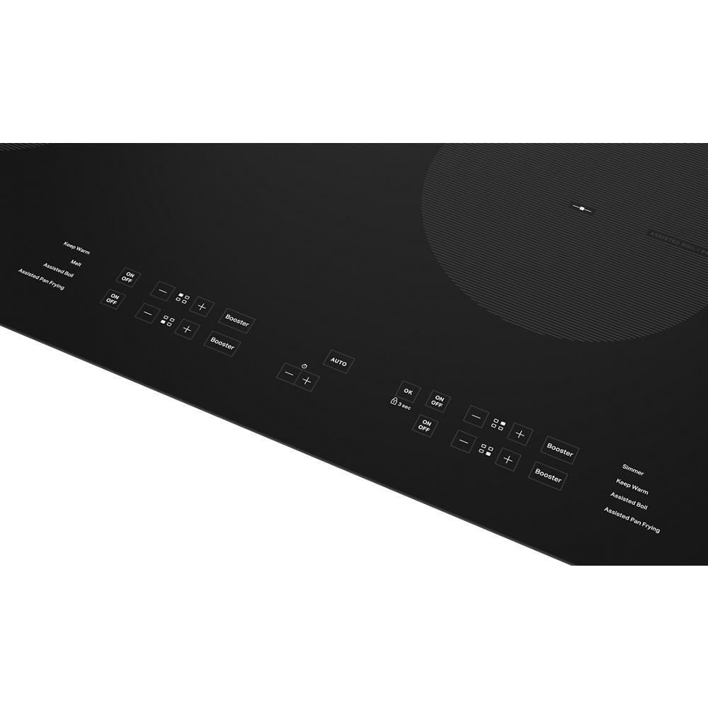 Black induction cooktop control panel with touch buttons for booster, timer, simmer, and assisted cooking features