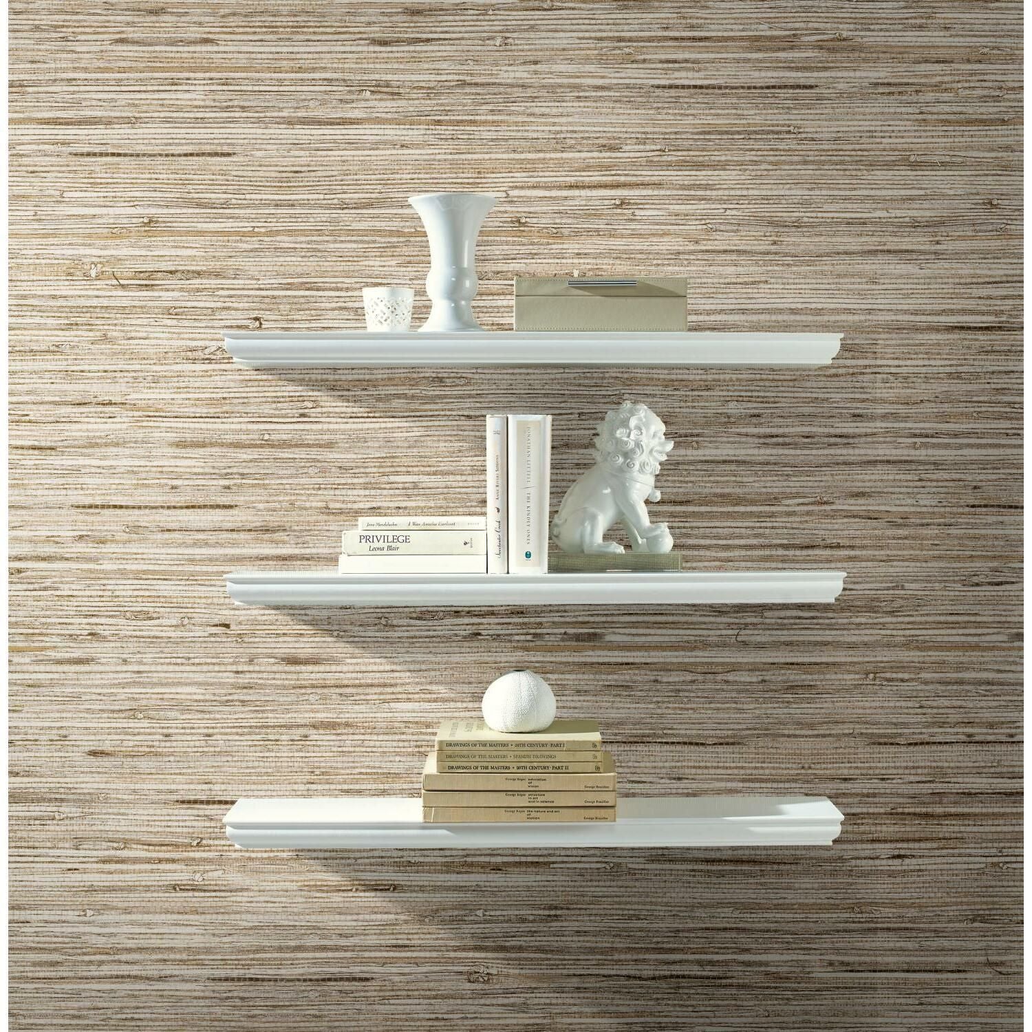 Light beige faux weave grasscloth wallpaper behind white floating shelves with decorative objects for home decor