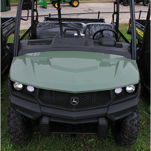 Green full-size crossover utility vehicle with roof and rugged tires designed for outdoor and home improvement tasks
