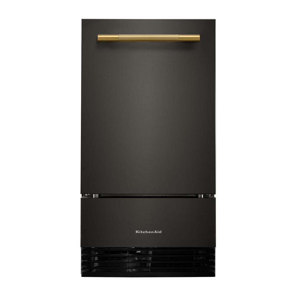 Matte black built-in ice maker with gold handle and front ventilation, designed for kitchen appliance collections
