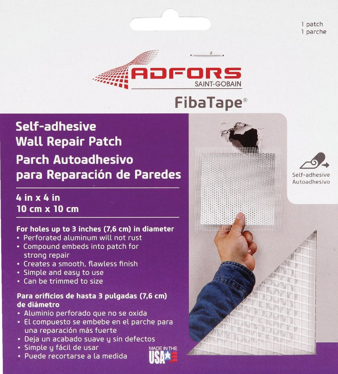 Hand holding self-adhesive perforated aluminum wall repair patch with damaged drywall background for home improvement
