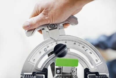 Hand adjusting a metal protractor angle stop for precise woodworking cuts in Festool and power tool accessories collections