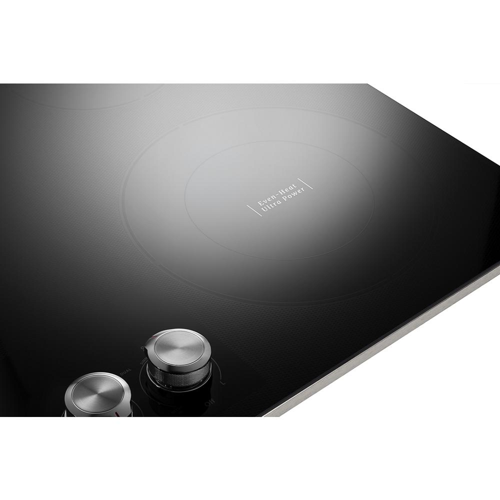 Glass electric cooktop with five radiant heating elements and two stainless steel knob controls for home improvement appliances