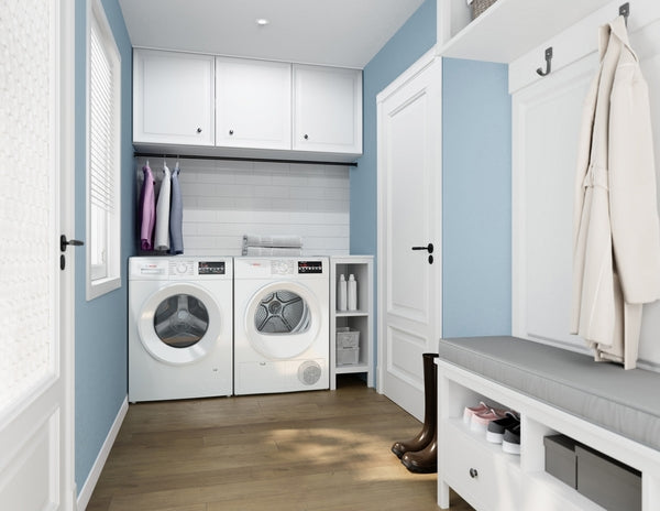 Laundry room with white Bosch washer and compact condensation dryer set against blue walls and wood flooring