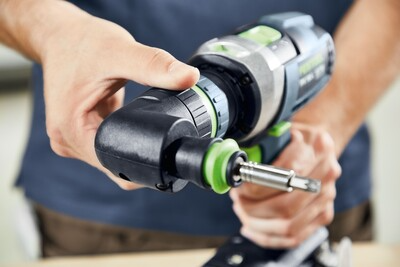 Hands adjusting drill settings on a Festool cordless hammer drill for precise tools and home improvement use