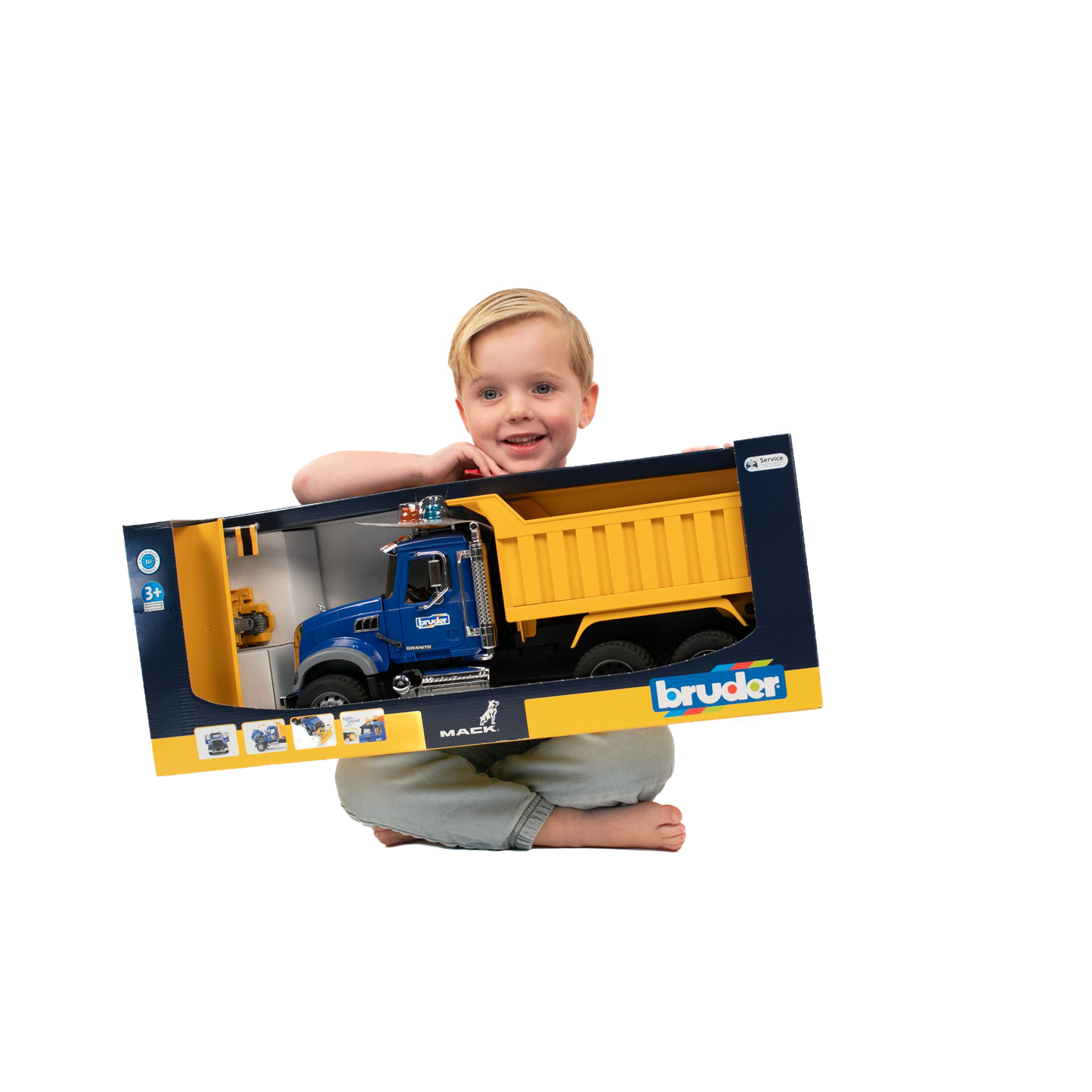 Child holding large blue and yellow Bruder Toys 1:16 scale Mack Granite dump truck box from Vehicles & Remote Controlled Toys collection