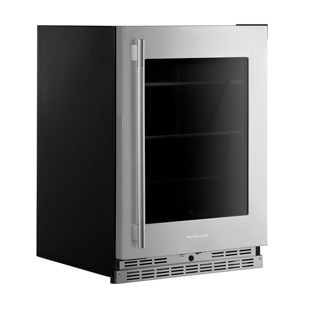 24-inch undercounter refrigerator with stainless steel frame, glass door, and metallic-trimmed shelves in KitchenAid collection