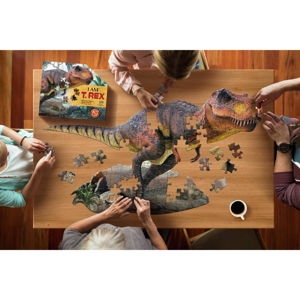 Partially assembled 100-piece dinosaur puzzle with T-Rex design and box on wooden table for Toys & Games collections under $50