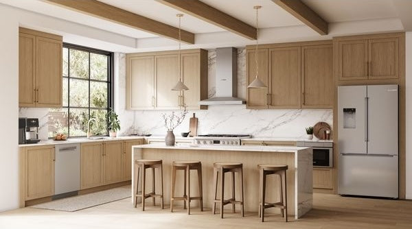 Modern kitchen with light wood cabinets, marble backsplash, stainless steel French door refrigerator, and island with stools
