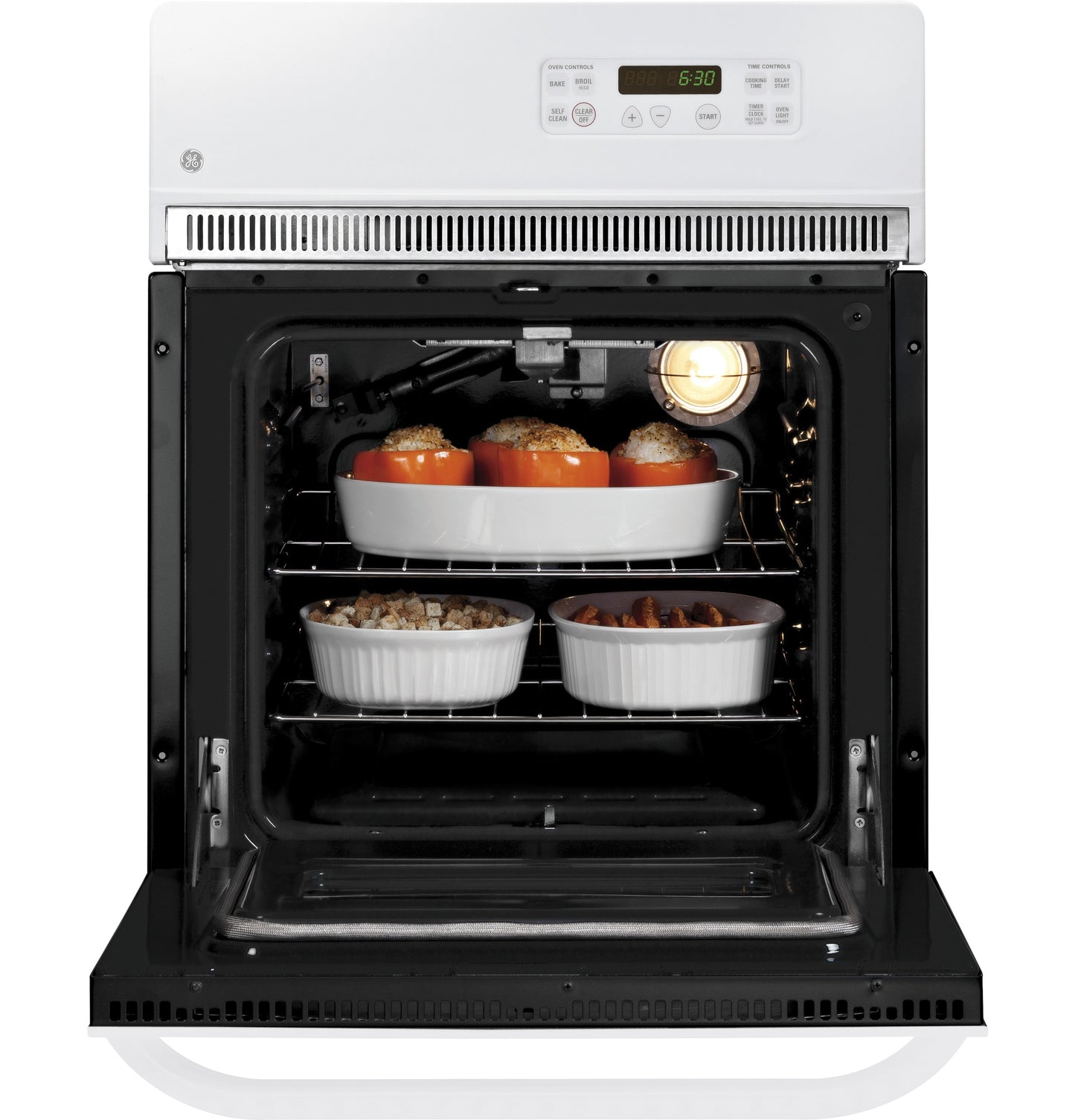 White electric single wall oven open with dishes baking inside from kitchen and appliances collection