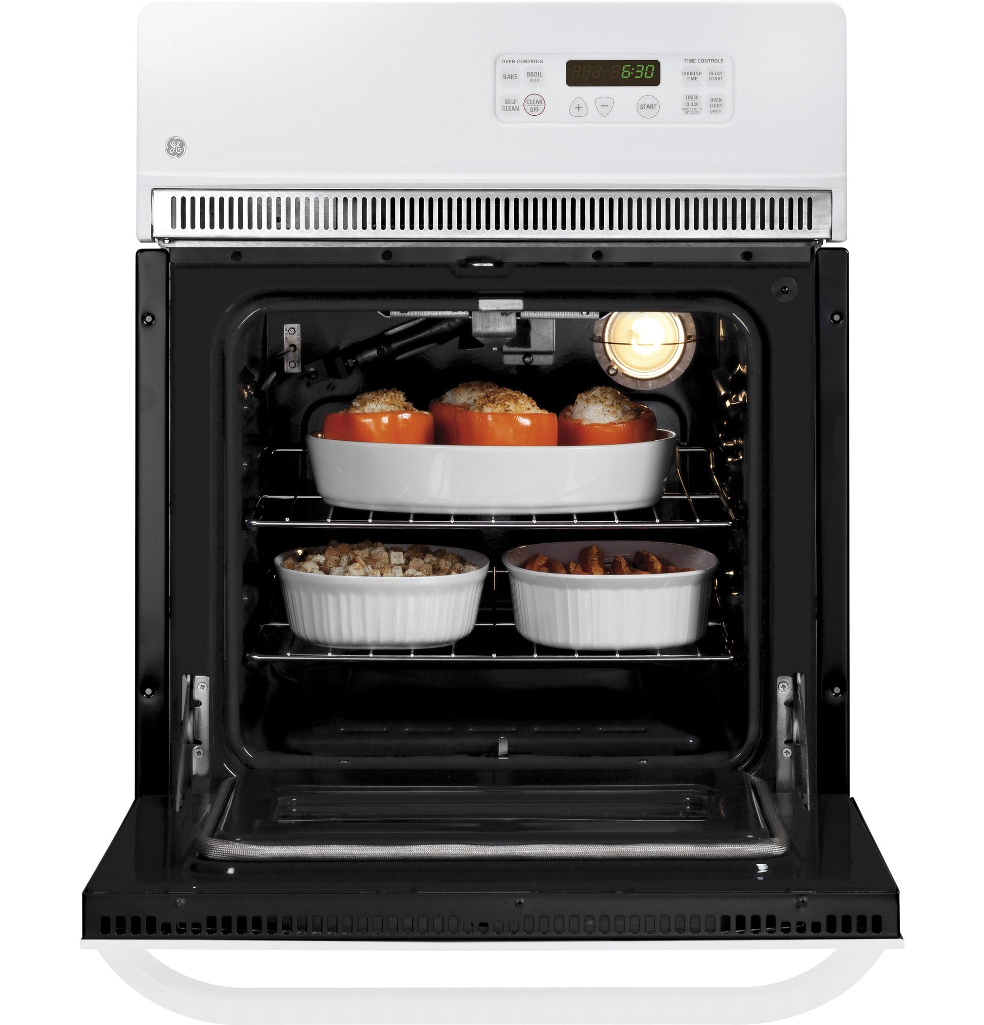 White electric single wall oven open with dishes baking inside from kitchen and appliances collection