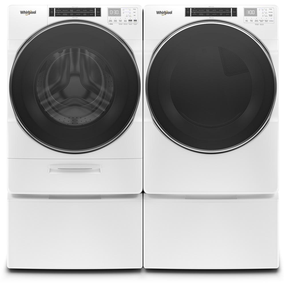 Whirlpool white front load washer and gas dryer pair with large dark doors and digital controls in Appliances collection at Hartville Hardware