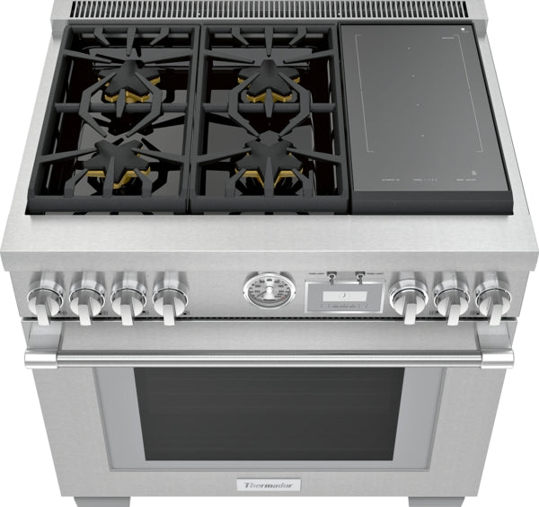 stainless steel dual fuel range with four gas burners, induction cooktop, control knobs, and built-in oven door handle
