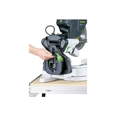 Hand adjusting the blade guard mechanism on a Festool sliding compound miter saw in power tools and saws collection