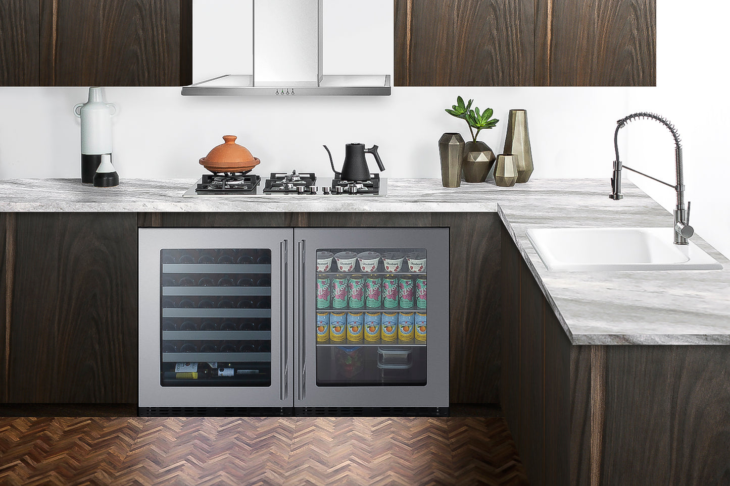 Under-counter beverage center with dual glass doors, stainless steel frame, stocked with drinks, in modern kitchen setting