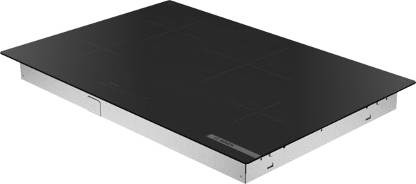 Sleek 30-inch induction cooktop with black glass surface and four cooking zones for modern kitchen appliances.
