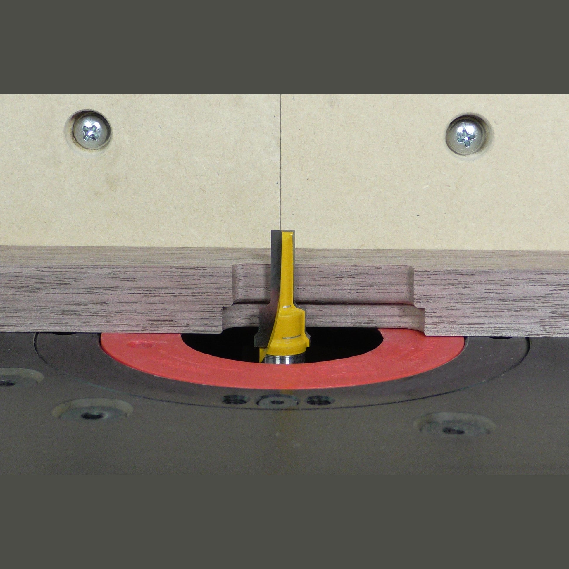 Yellow 2-step plunge router bit with 1/4-inch shank mounted in woodworking tool for precision cuts under $100 collections