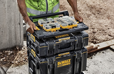 Stacked black and yellow DEWALT ToughSystem toolboxes connected with 2.0 adaptor for workshop organization and storage solutions