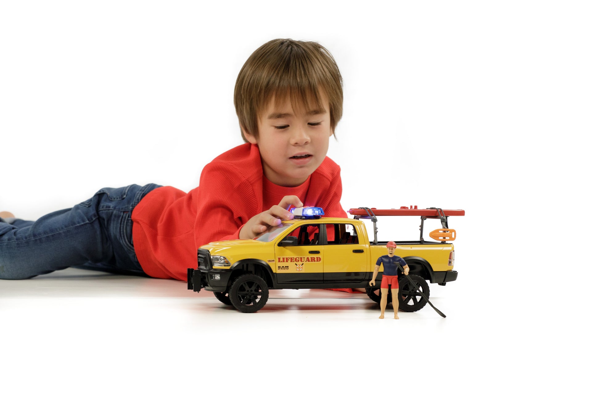 Child playing with yellow lifeguard pickup toy and accessories from Vehicles & Remote Controlled Toys collection