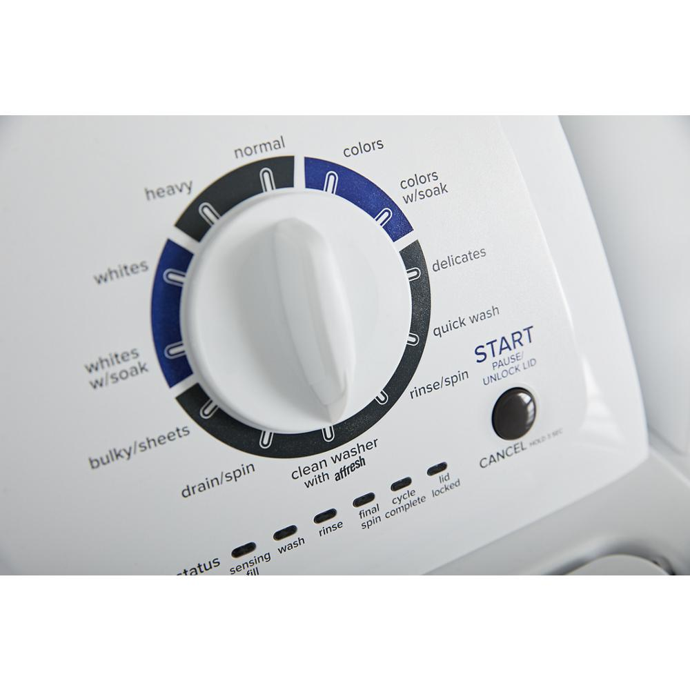 Close-up of white top load washer control knob with cycle options and start button from washers and appliances collection