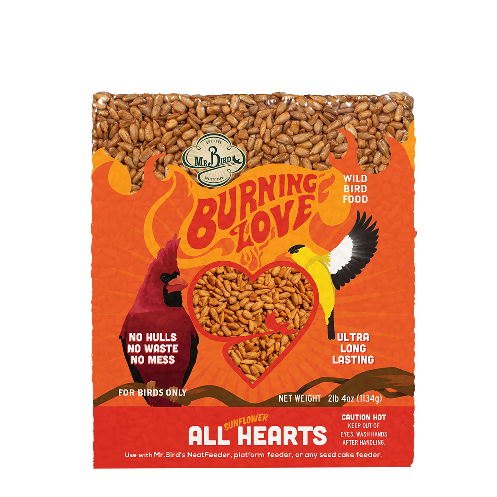 Orange package of Mr. Bird Burning Love large sunflower seed cake with bird illustrations and heart-shaped cutout