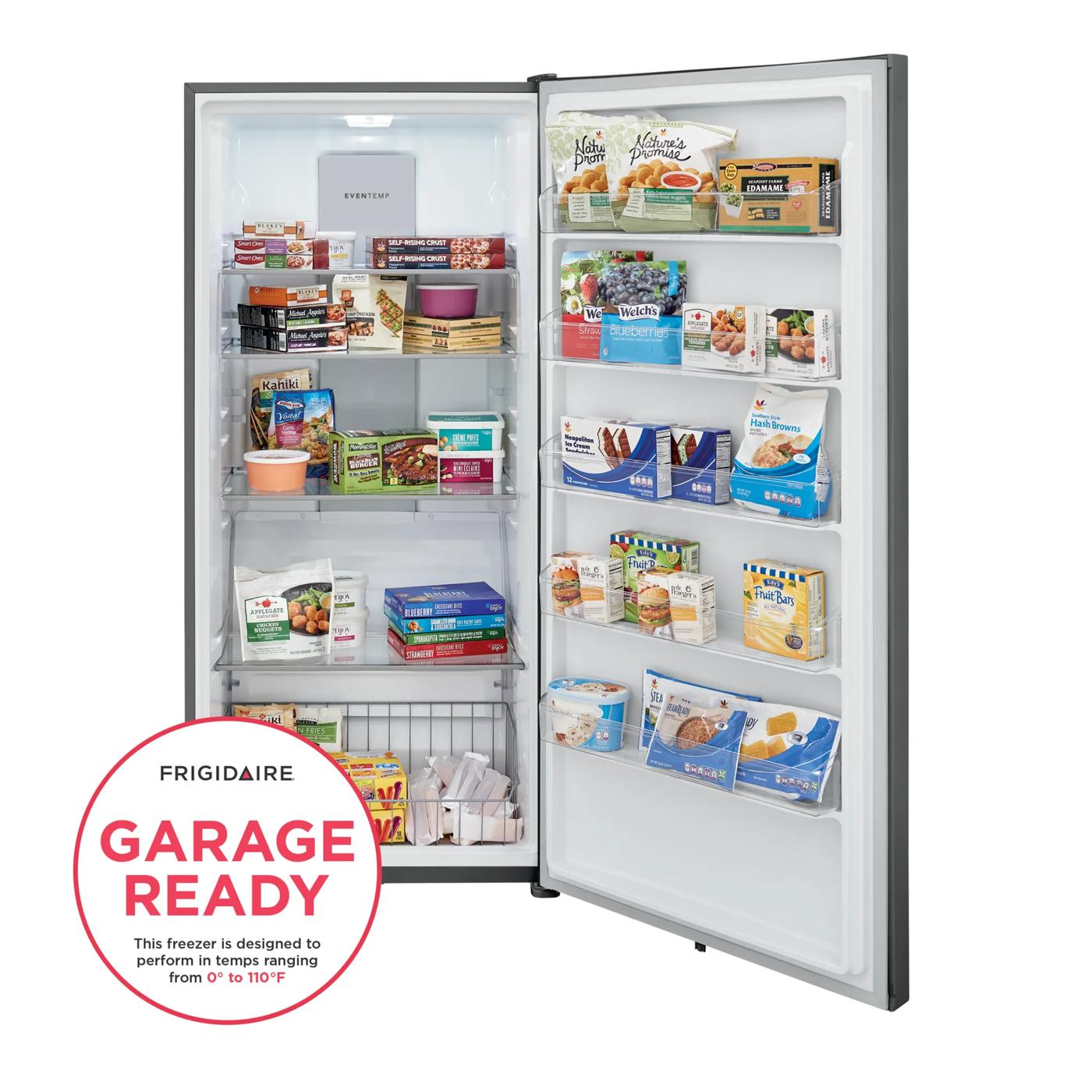 Open upright freezer stocked with frozen meals and snacks, designed for garage or kitchen use in home appliances.
