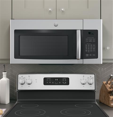 Stainless steel over-the-range microwave with digital control panel installed above electric stove in modern kitchen setting