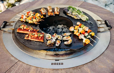 Hot-rolled carbon steel searplate griddle with handles for outdoor living and fire pit cooking by Hartville Kitchen