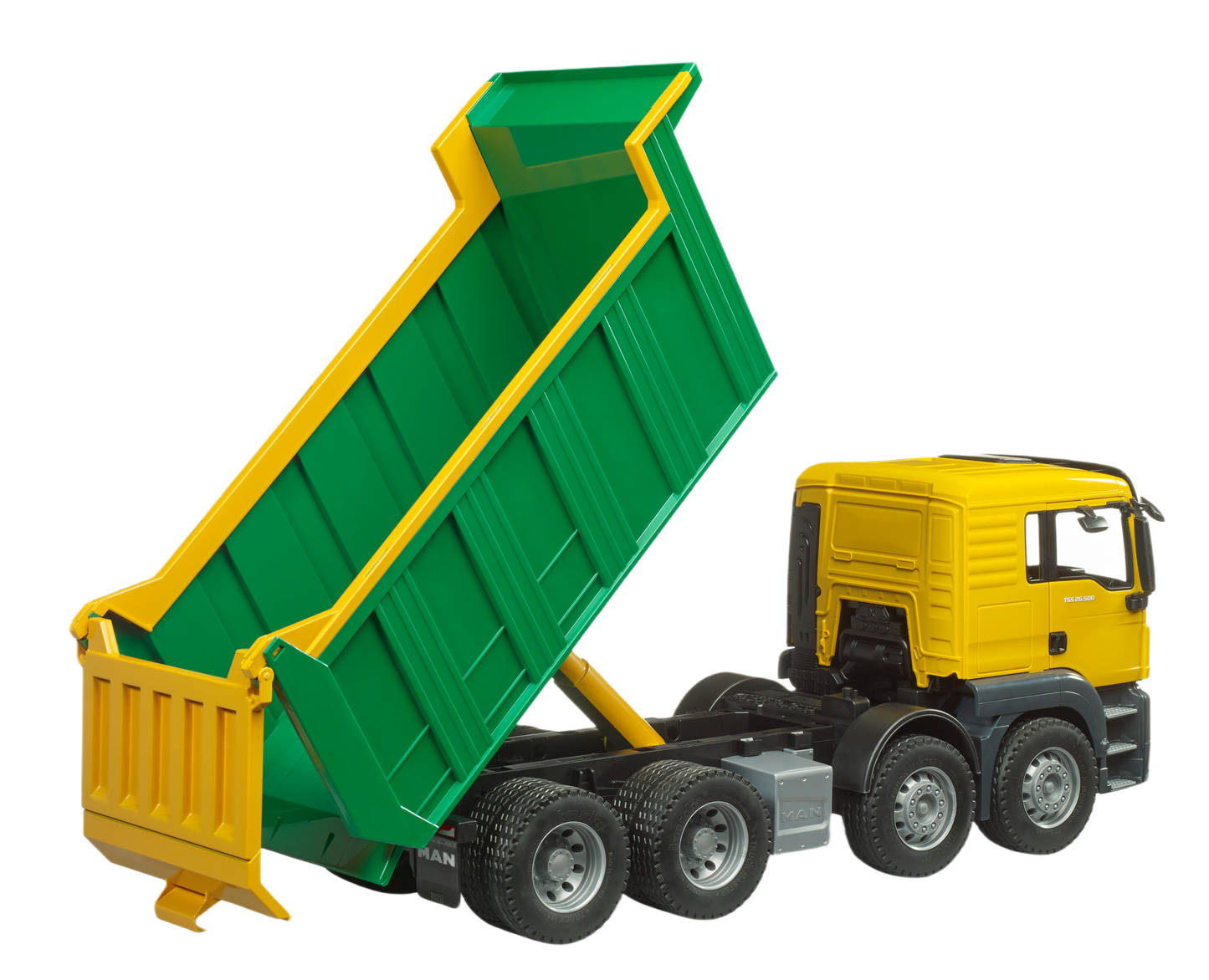Green dumping bed raised on yellow and black Bruder Man toy truck with detailed wheels for construction play
