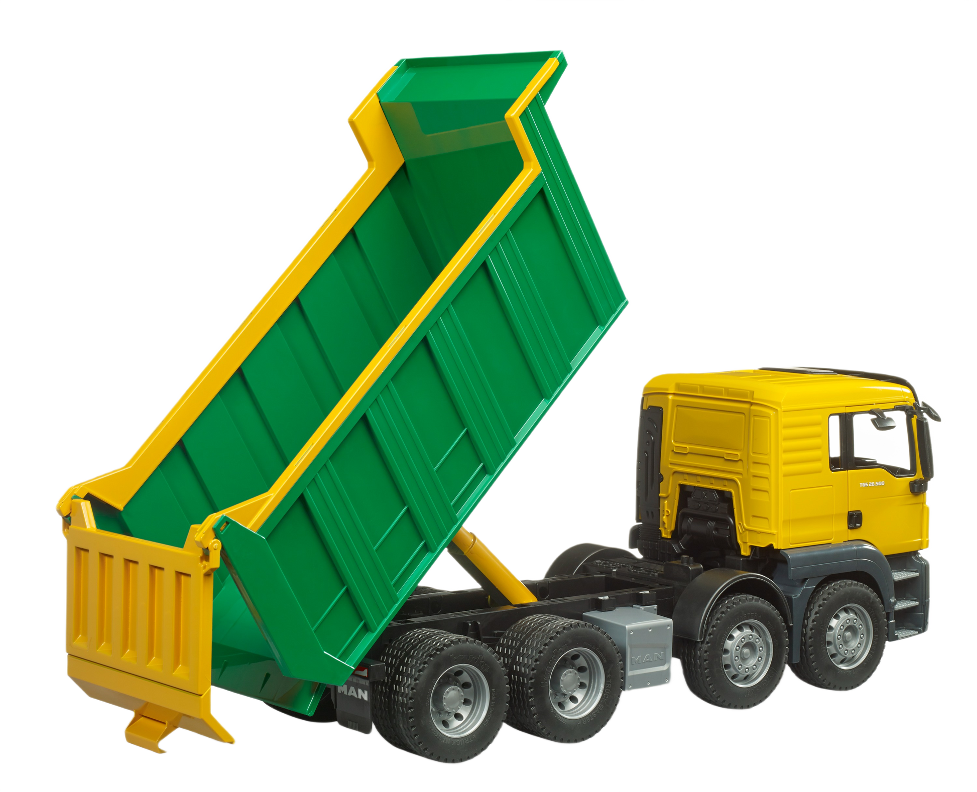 Green dumping bed raised on yellow and black Bruder Man toy truck with detailed wheels for construction play