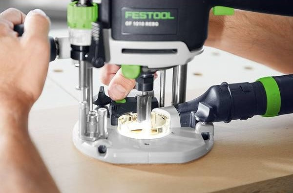 Close-up of Festool router in use on wood, showcasing precision woodworking tool from Routers and Woodworking Tools collection