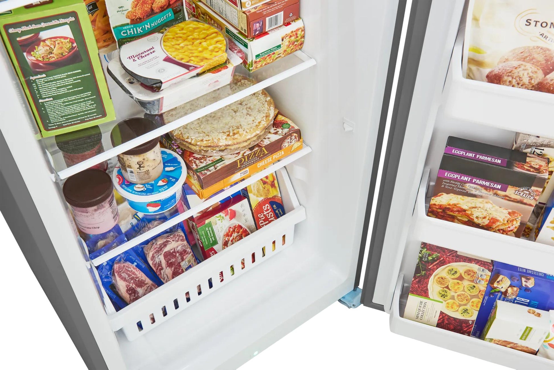 Interior view of an open freezer showing organized frozen meals, ice cream, and packaged foods, suitable for Freezers & Ice Makers, Kitchen & Kitchenware, and Appliances collections.