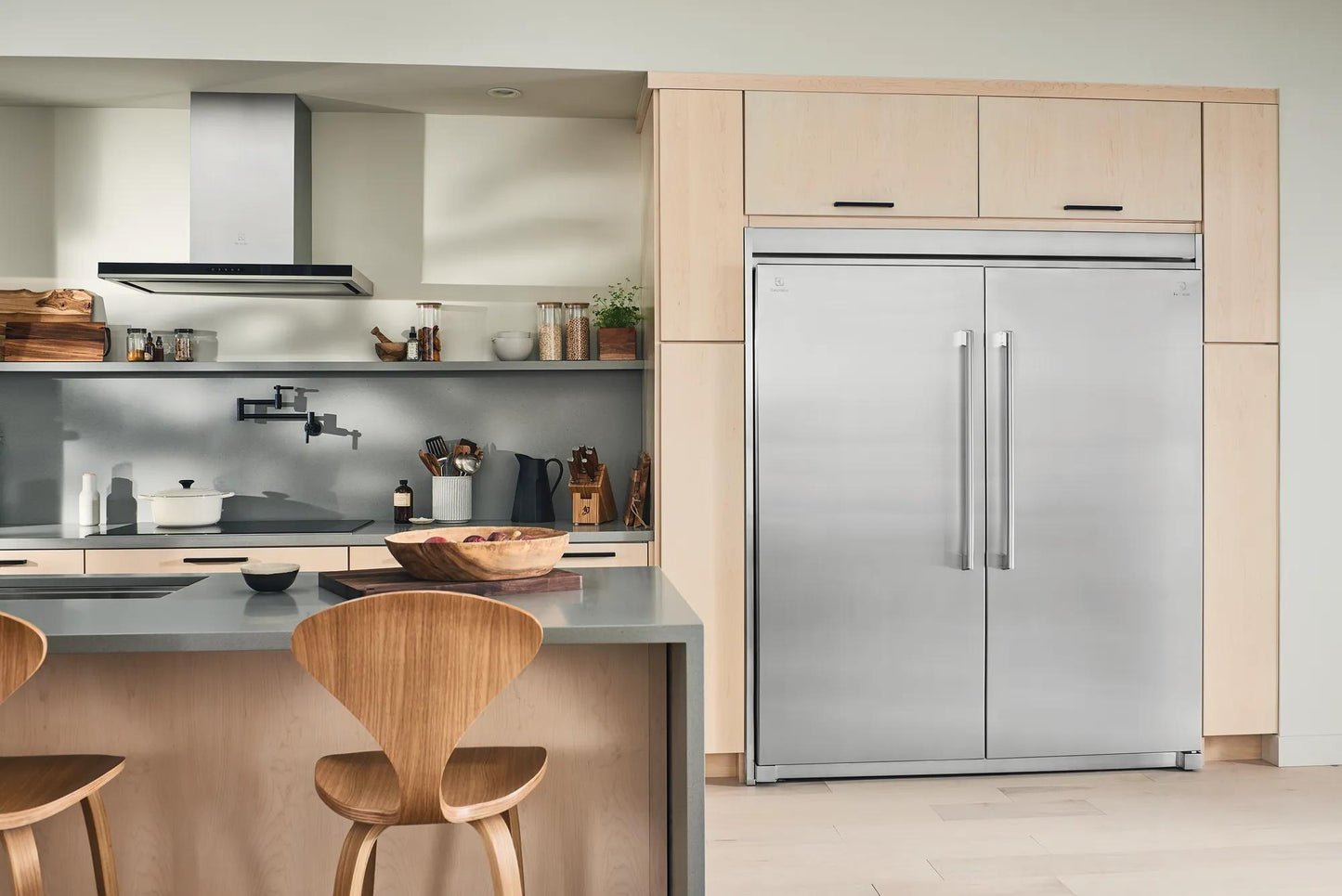 Built-in double-door stainless steel freezer with vertical handles in modern kitchen setting from Appliances and Freezers collections